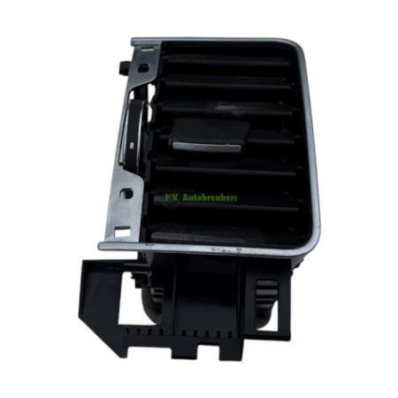 Close-up of a car HVAC blower housing with black vent fins and mounting bracket in view.