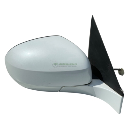 White detached car side mirror housing with a black triangular mounting fin and a wiring connector visible