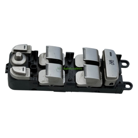 Power window switch module with four chrome buttons on a black base.