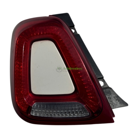 Close-up of a car tail light with red outer housing and a clear rectangular reverse-light at the bottom.