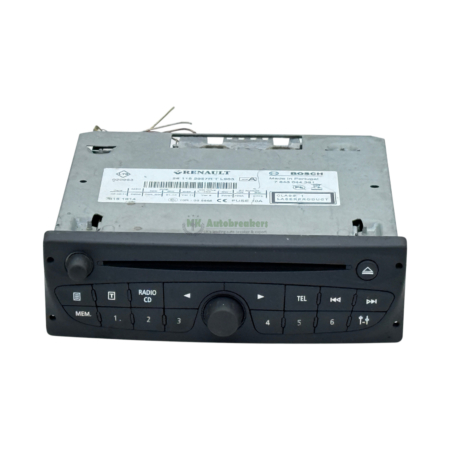 Car stereo head unit with CD slot, radio controls, and a large central knob visible on the front panel.