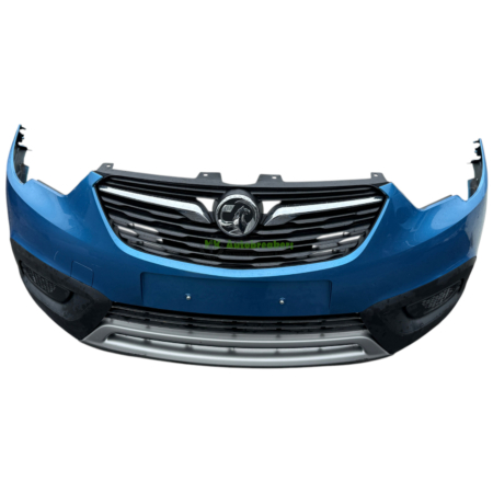 Front view of a blue car bumper with a black grille and chrome accents, centered badge visible in the middle panel of the grille. This is the car's front end when the bumper is attached.