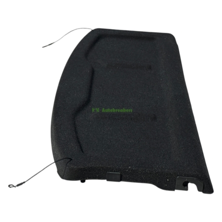 Black automotive seat cushion piece with visible mounting hardware and tether cord.